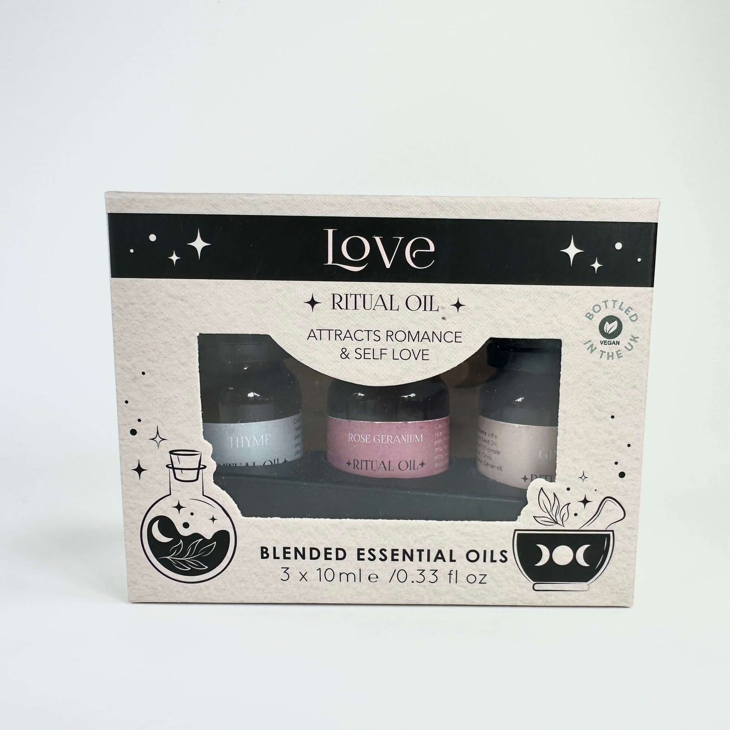 Æske med æteriske olier, der tiltrækker romantik og selvkærlighed, indeholder tre små flasker.